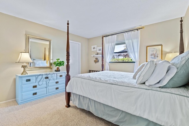 bedroom featuring light colored carpet