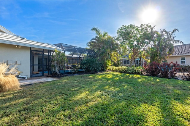 view of yard featuring a lanai