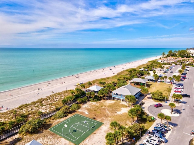 birds eye view of property featuring a water view and a view of the beach