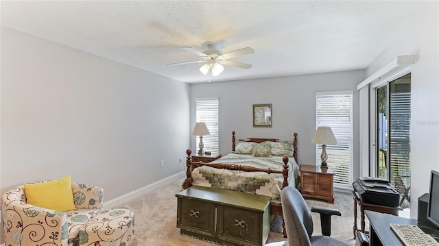 bedroom featuring ceiling fan and light colored carpet