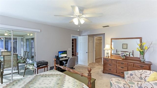 bedroom featuring ceiling fan, access to exterior, light carpet, and a closet