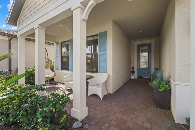 entrance to property featuring a porch