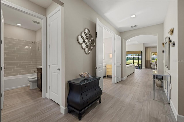 corridor featuring light hardwood / wood-style floors