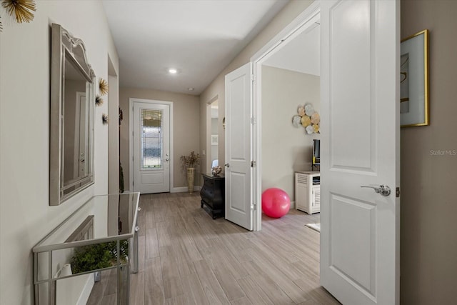 hall with light hardwood / wood-style floors