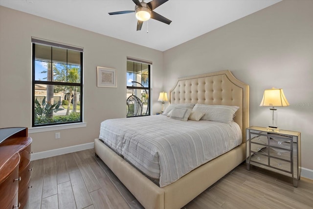 bedroom featuring hardwood / wood-style floors and ceiling fan