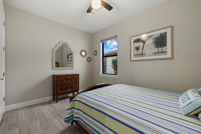 bedroom with ceiling fan and light hardwood / wood-style flooring