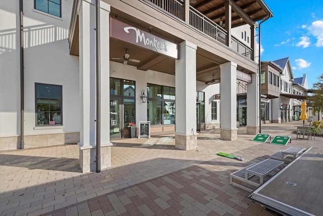 exterior space with ceiling fan