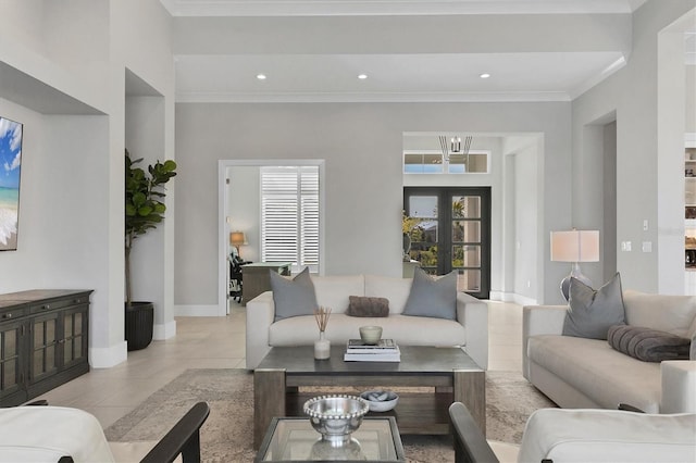 tiled living room with french doors and crown molding