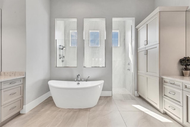 bathroom with tile patterned flooring, vanity, and independent shower and bath