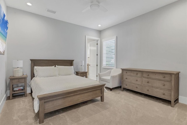 bedroom featuring ceiling fan and light carpet