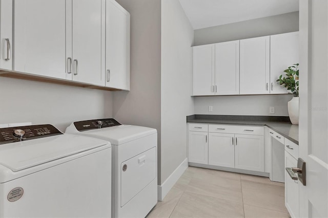 washroom with cabinets, light tile patterned floors, and separate washer and dryer