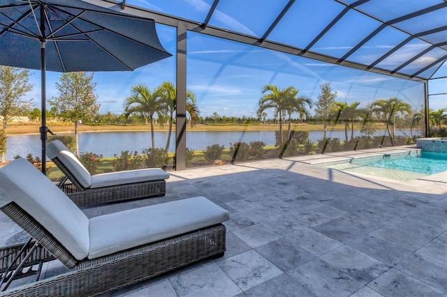 view of patio featuring a water view and a lanai