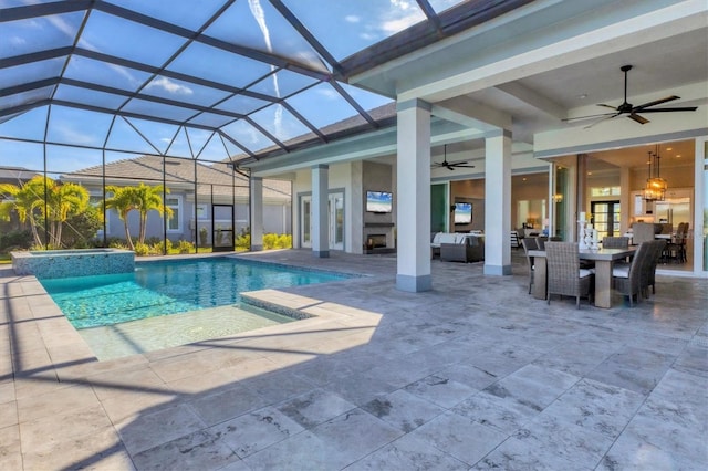 view of pool featuring outdoor lounge area, glass enclosure, ceiling fan, and a patio area