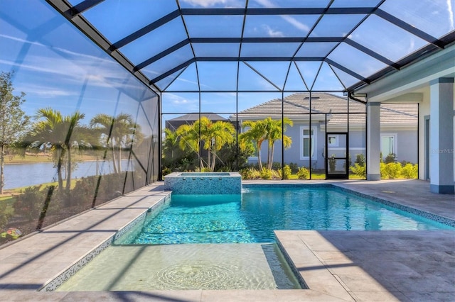 view of swimming pool with a patio area, a lanai, an in ground hot tub, and a water view