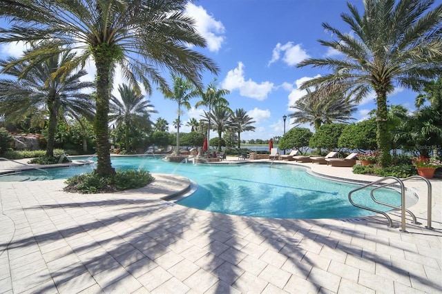 view of swimming pool with a patio