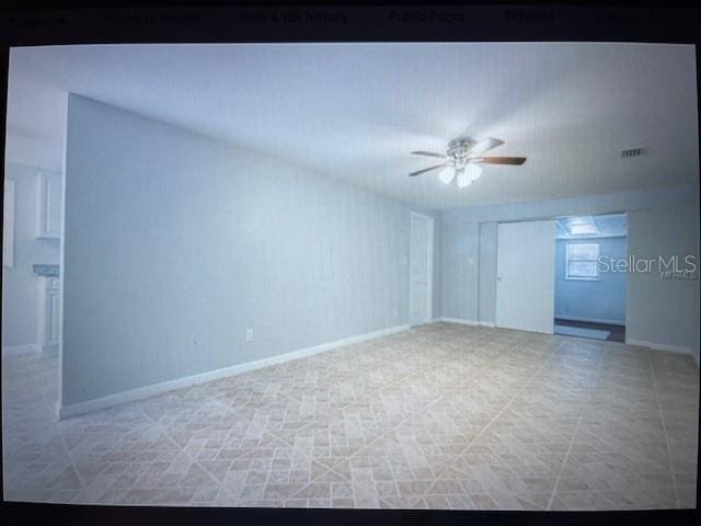 spare room with ceiling fan