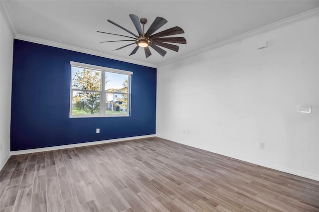 spare room with light hardwood / wood-style flooring, ceiling fan, and crown molding