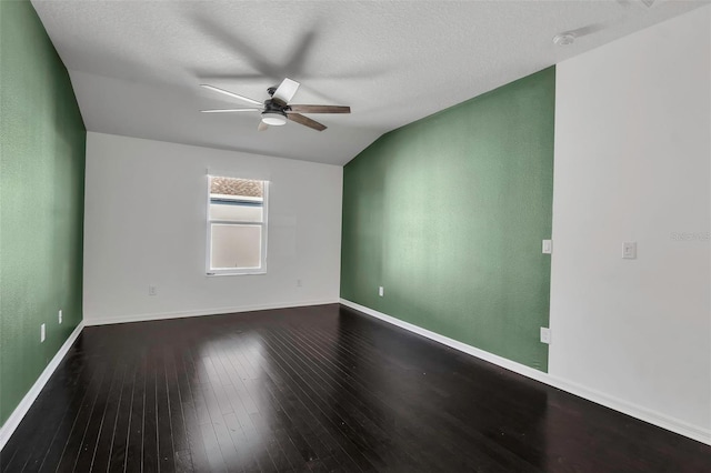 empty room featuring wood-type flooring, a textured ceiling, vaulted ceiling, and ceiling fan