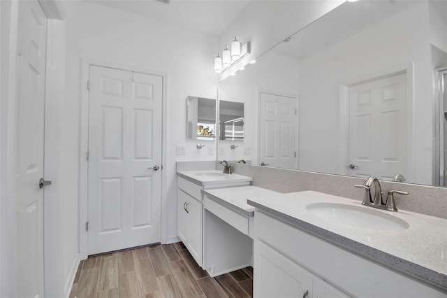 bathroom featuring vanity and hardwood / wood-style flooring