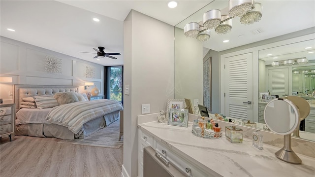 bedroom featuring ceiling fan and light hardwood / wood-style floors