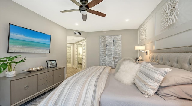 bedroom featuring hardwood / wood-style flooring and ceiling fan