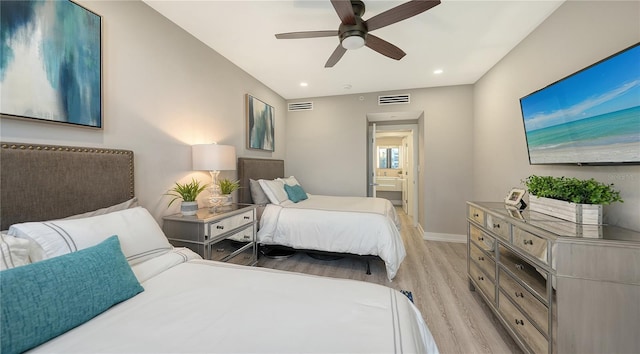 bedroom featuring ceiling fan, light wood-type flooring, and connected bathroom