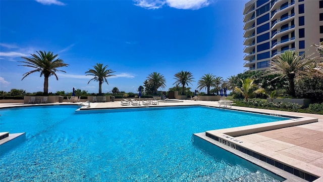 view of swimming pool featuring a patio area