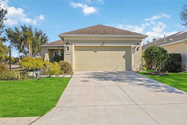 view of front of property with a front lawn and a garage