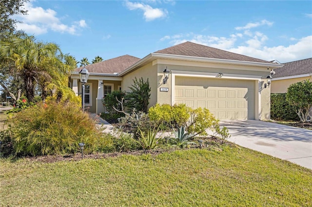 view of front facade featuring a front yard and a garage