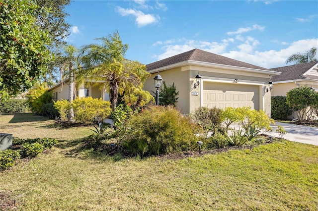 view of front of house featuring a front yard and a garage