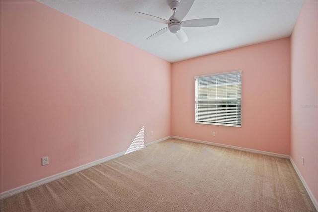 carpeted empty room with ceiling fan