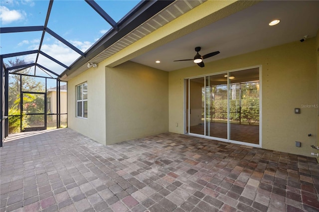 view of patio with a lanai and ceiling fan