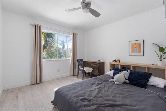 bedroom with ceiling fan and light hardwood / wood-style flooring