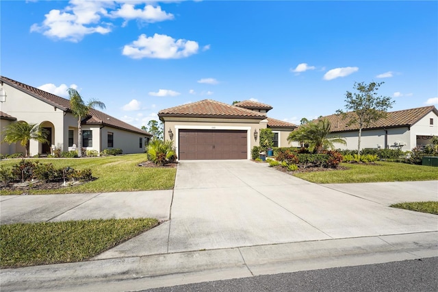 mediterranean / spanish-style house with a front lawn and a garage