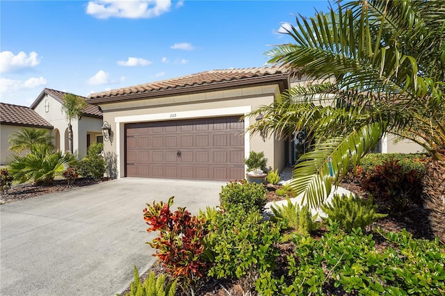 mediterranean / spanish-style home with a garage