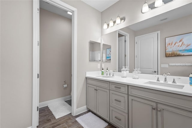 bathroom featuring hardwood / wood-style floors, vanity, and toilet