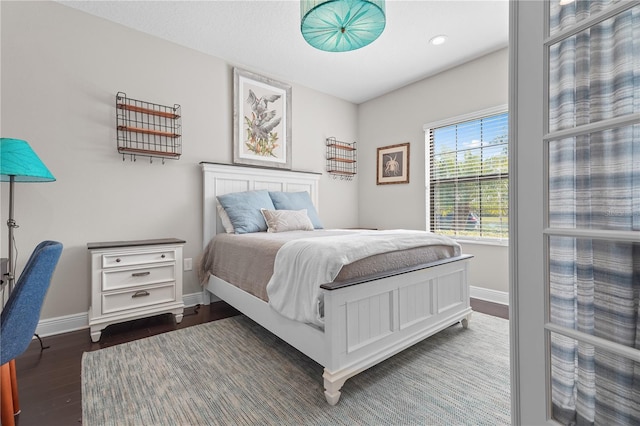 bedroom featuring dark hardwood / wood-style flooring