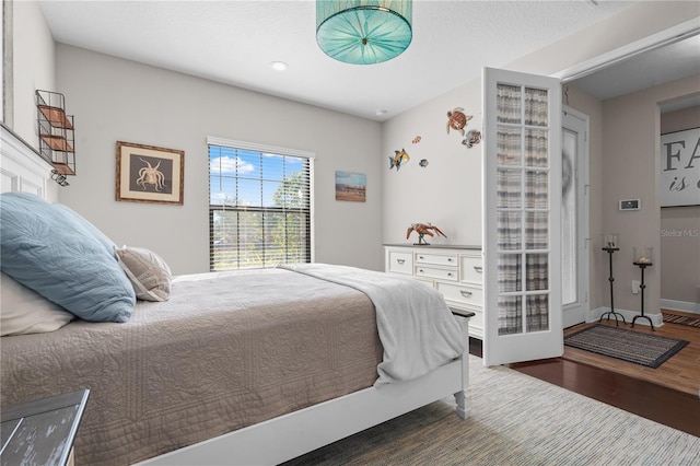 bedroom featuring dark wood-type flooring