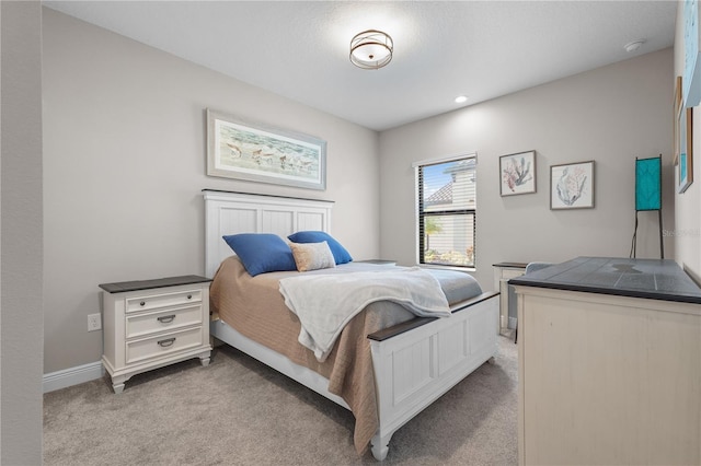 bedroom with light colored carpet