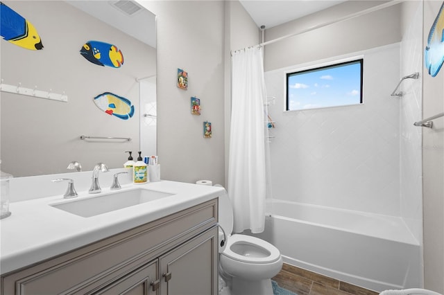 full bathroom featuring hardwood / wood-style flooring, vanity, toilet, and shower / tub combo