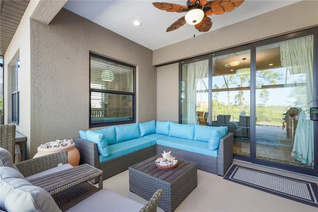 exterior space featuring outdoor lounge area and ceiling fan