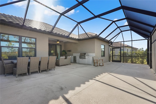 view of patio / terrace with ceiling fan, area for grilling, a lanai, and grilling area