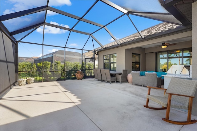 view of patio featuring ceiling fan, a lanai, and an outdoor hangout area