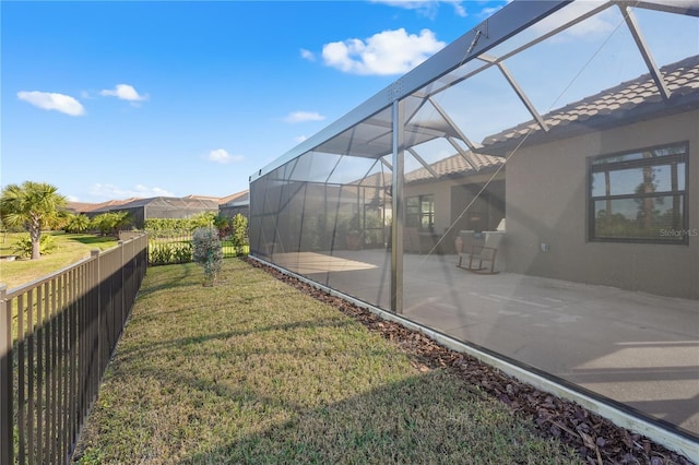 view of yard featuring a patio area and a lanai