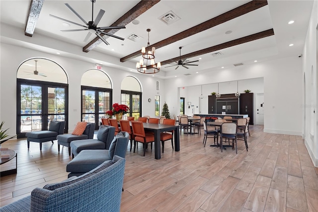 dining area with beamed ceiling, french doors, light wood-type flooring, and plenty of natural light