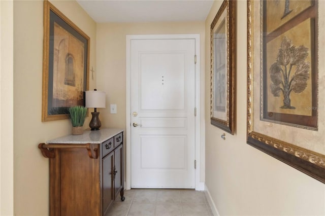 hallway featuring light tile patterned floors