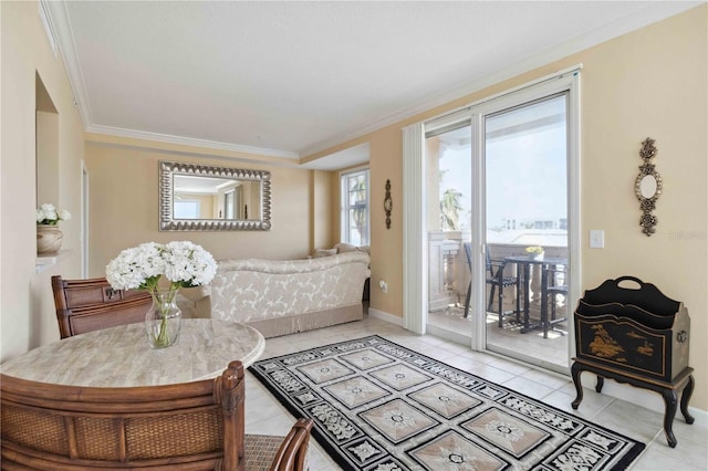 sitting room featuring light tile patterned floors and crown molding