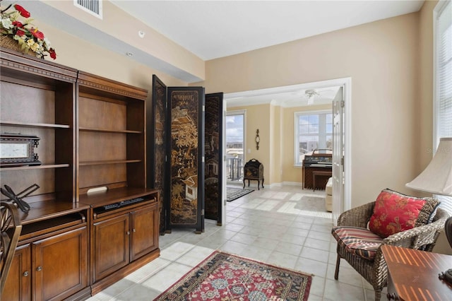 interior space featuring ceiling fan