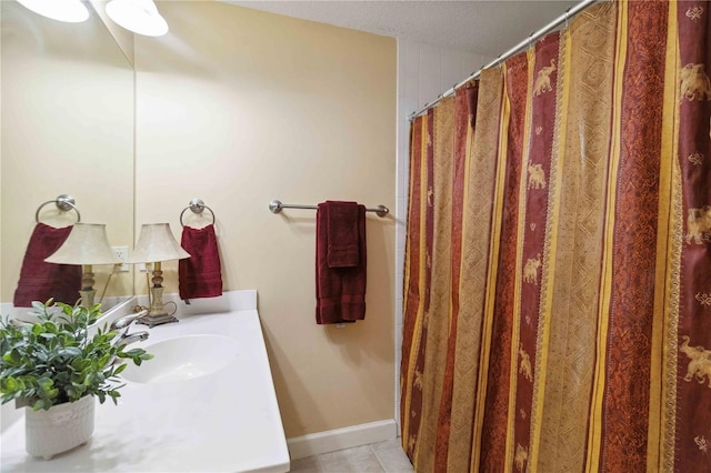 750 N Tamiami Trl Unit 420, Sarasota, FL 34236 - full bath with vanity and tile patterned floors