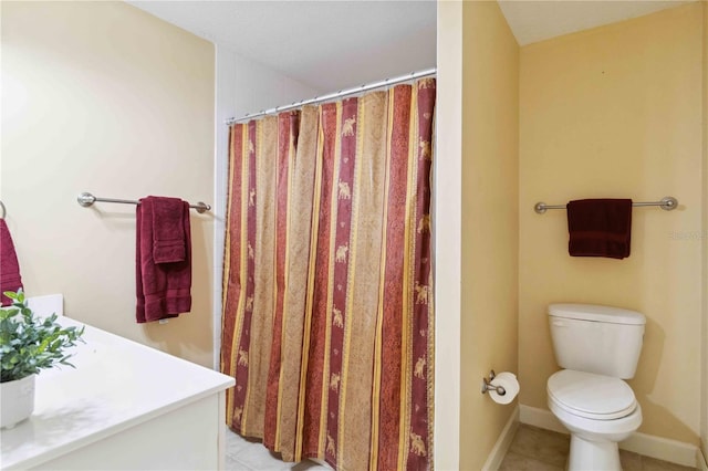 bathroom with tile patterned flooring, a shower with shower curtain, and toilet